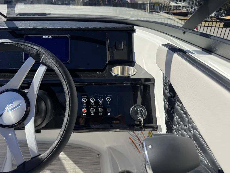Slide: The Image of Interior view of Sea Ray SPO210 boat cockpit, model year 2026. - 15