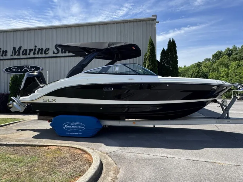 The Image of 2026 Sea Ray SXO260 boat displayed outside a building. - 1