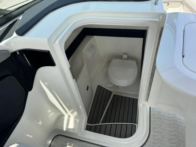 Slide: The Image of Interior of 2026 Sea Ray SXO260 featuring a toilet. - 14