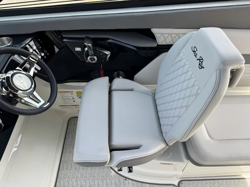 Slide: The Image of Interior of 2026 Sea Ray SXO260 with steering wheel and seat. - 15