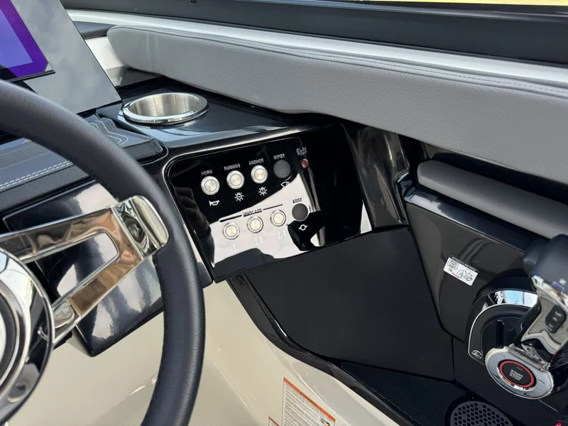 Slide: The Image of Interior view of Sea Ray SXO260 2026 helm controls. - 16