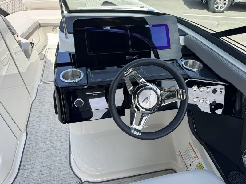 Slide: The Image of Interior view of Sea Ray SXO260 2026 helm. - 17