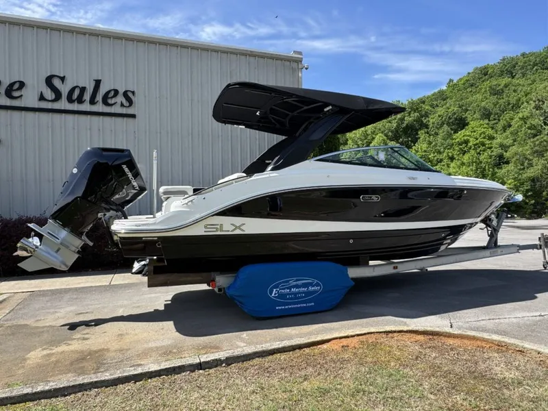 Slide: The Image of 2026 Sea Ray SXO260 boat at a sales dealership. - 4