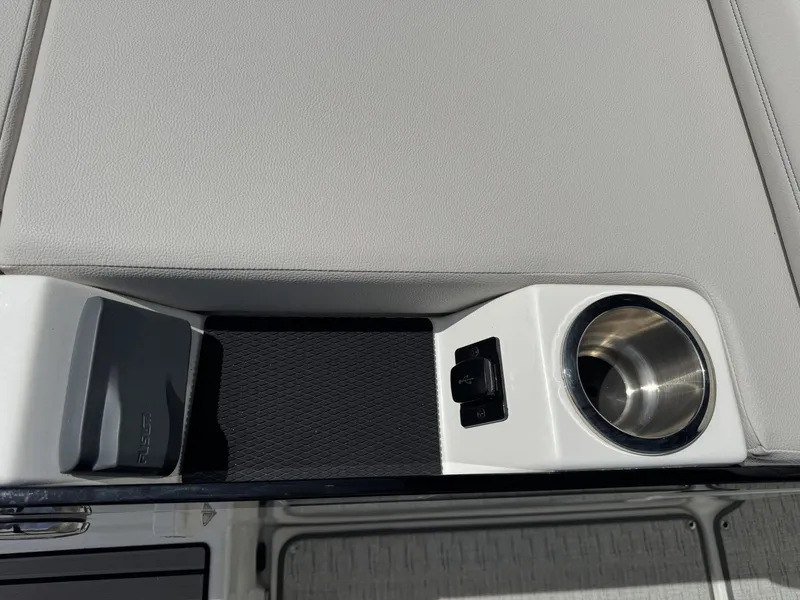 Slide: The Image of Interior of 2026 Sea Ray SXO260 with cup holder and USB port. - 7