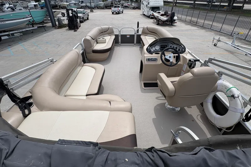 Slide: The Image of 2016 Sun Tracker Party Barge 20 DLX pontoon boat with spacious seating and modern helm. - 18