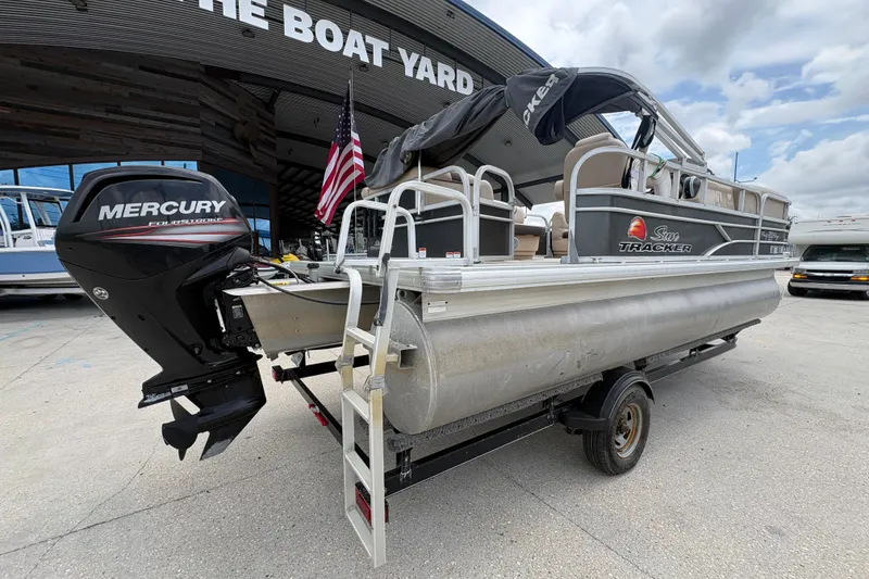 Slide: The Image of 2016 Sun Tracker Party Barge 20 DLX pontoon boat with Mercury engine at a boat yard. - 4
