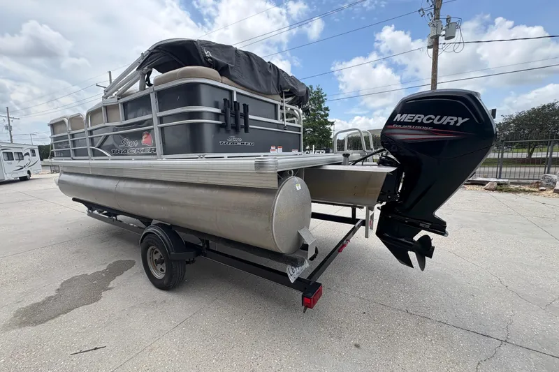 Slide: The Image of 2016 Sun Tracker Party Barge 20 DLX pontoon boat with Mercury outboard motor on trailer. - 6
