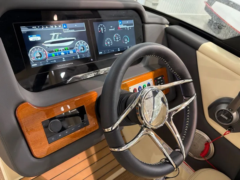 Slide: The Image of Interior view of 2026 Chris-Craft Sportster 28 with modern dashboard controls. - 19