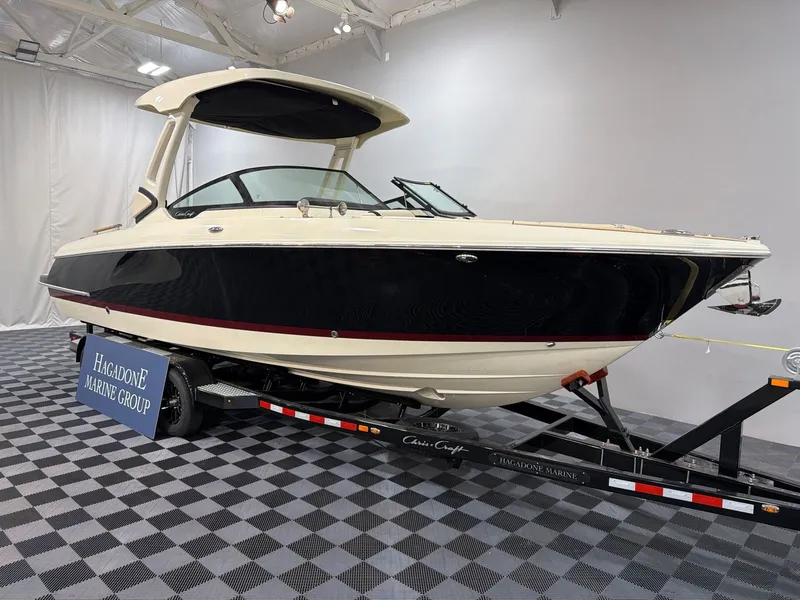 Slide: The Image of 2026 Chris-Craft Sportster 28 on trailer in showroom. - 2