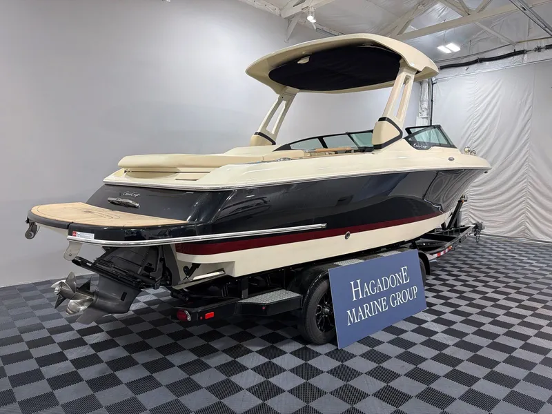 Slide: The Image of 2026 Chris-Craft Sportster 28 boat in showroom. - 3