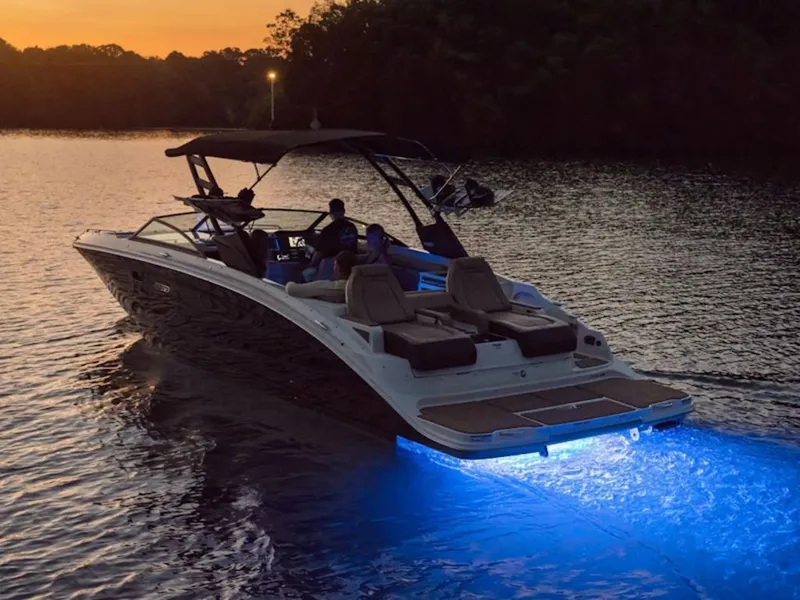 The Image of 2025 Sea Ray SDX 290 boat at sunset on the water. - 0