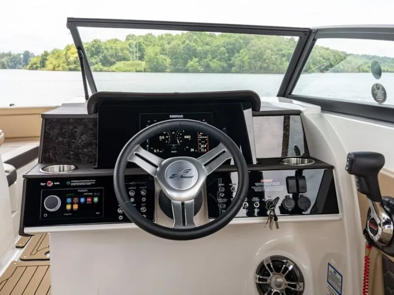 Slide: The Image of Helm of 2025 Sea Ray SDX 290 on a tranquil lake. - 7