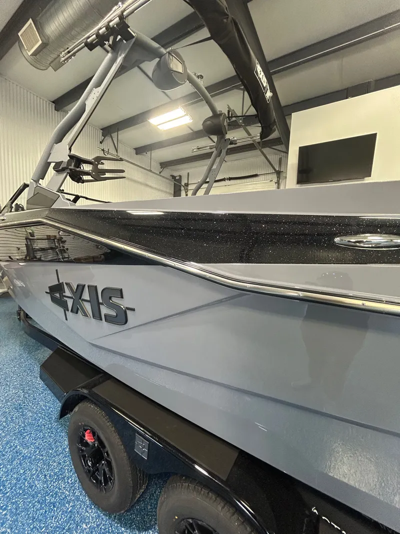 Slide: The Image of 2026 Axis T235 boat in a modern storage facility. - 2