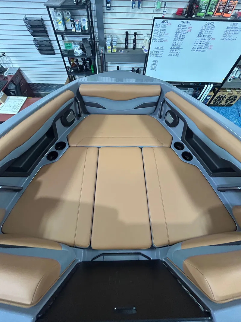 Slide: The Image of Interior of Axis T235 boat, 2026 model, featuring beige upholstery. - 7