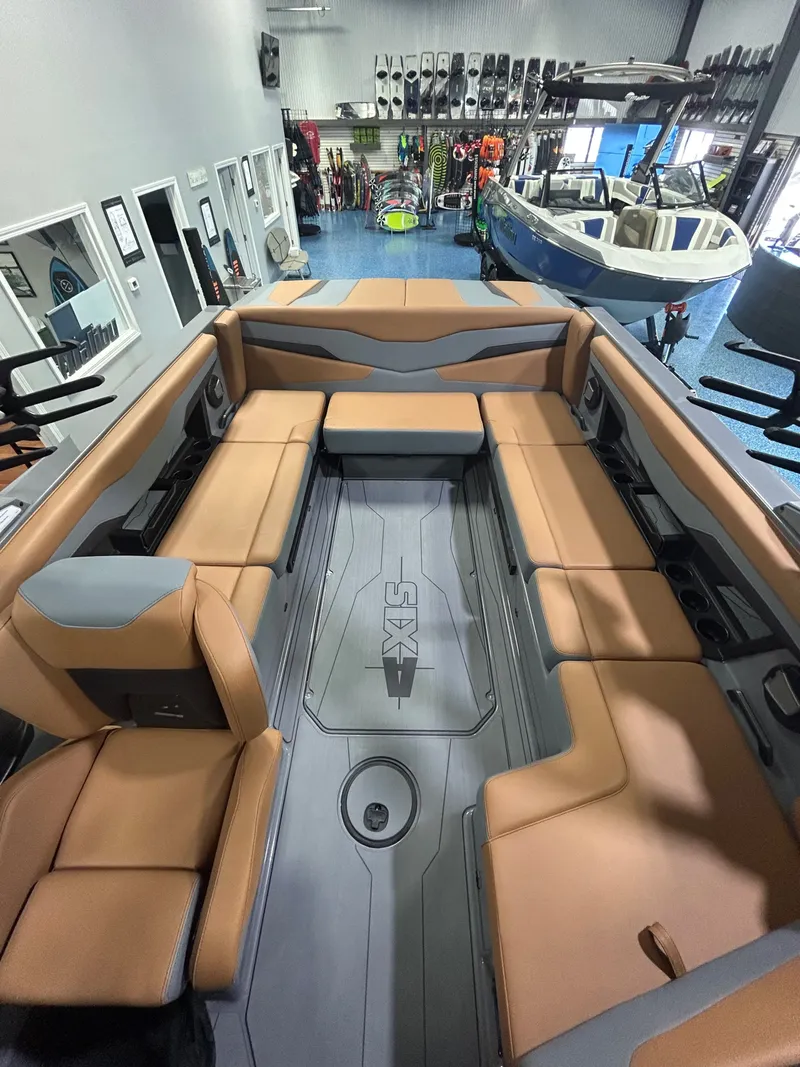 Slide: The Image of Interior of a 2026 Axis T235 boat with beige seating. - 8