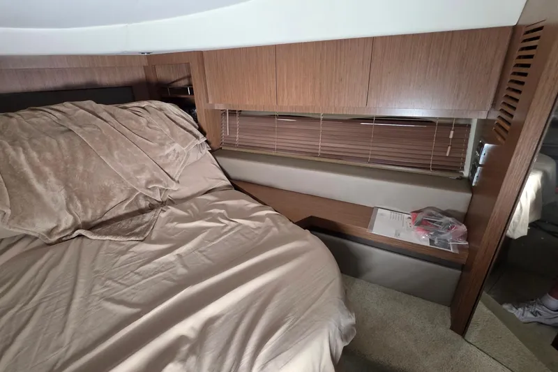 Slide: The Image of Interior cabin of 2018 Sea Ray Sundancer 510 yacht with bed and wooden cabinetry. - 13