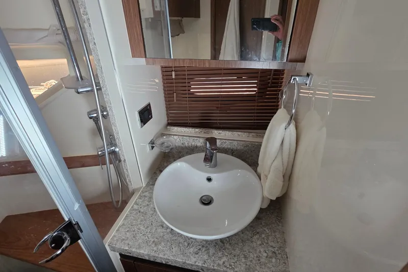 Slide: The Image of Luxurious bathroom in 2018 Sea Ray Sundancer 510 yacht with modern sink and shower. - 15