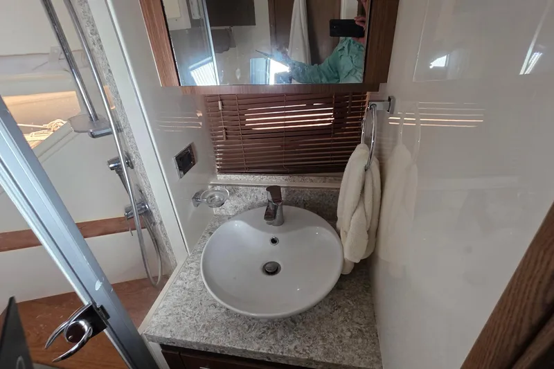 Slide: The Image of Bathroom interior of 2018 Sea Ray Sundancer 510 yacht with modern sink and shower. - 16