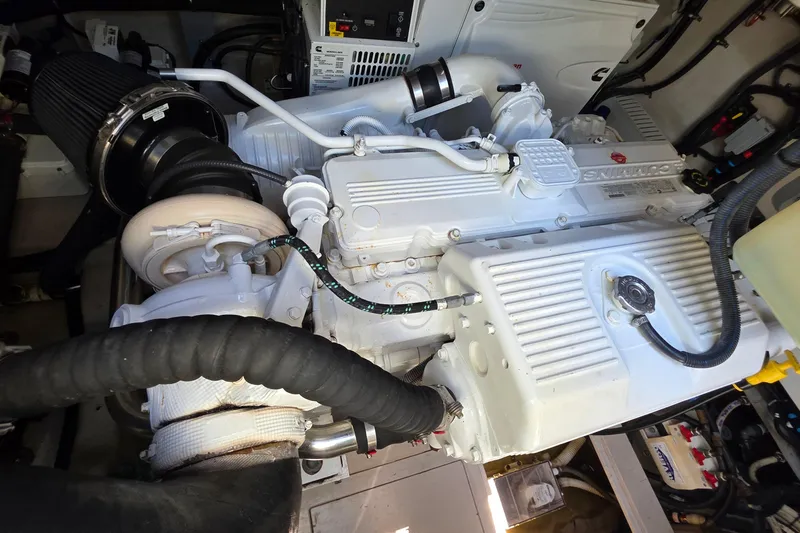 Slide: The Image of Engine compartment of a 2018 Sea Ray Sundancer 510 yacht, showcasing detailed mechanical components. - 19