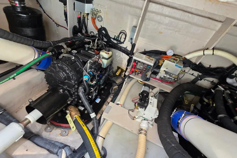 Slide: The Image of Engine room of 2018 Sea Ray Sundancer 510 yacht, showcasing mechanical components and wiring. - 20