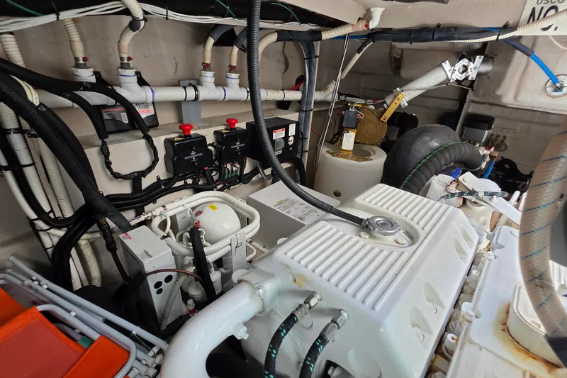 Slide: The Image of Engine room of 2018 Sea Ray Sundancer 510 with complex piping and machinery. - 21