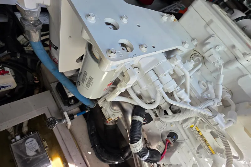 Slide: The Image of Engine compartment of a 2018 Sea Ray Sundancer 510 yacht, showcasing mechanical components. - 25