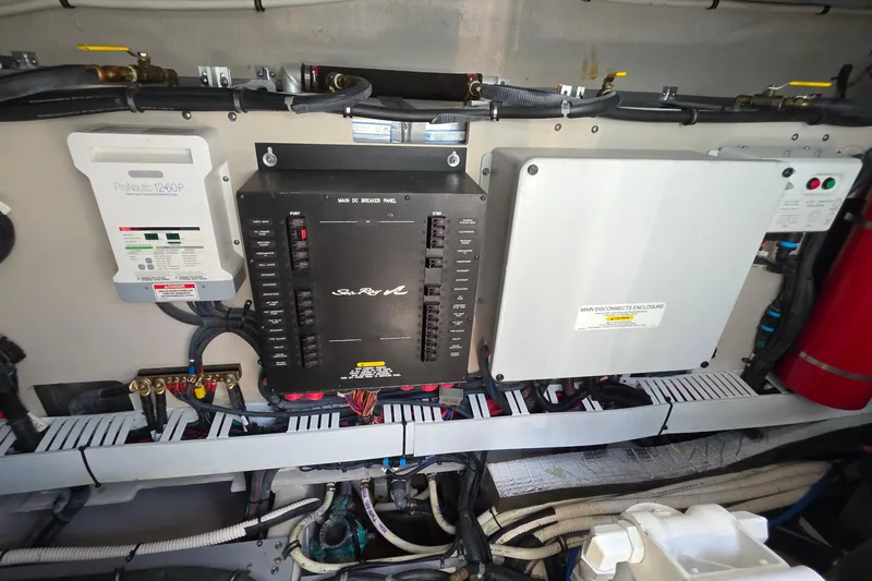 Slide: The Image of Electrical panel of 2018 Sea Ray Sundancer 510 yacht, featuring circuit breakers and wiring. - 26