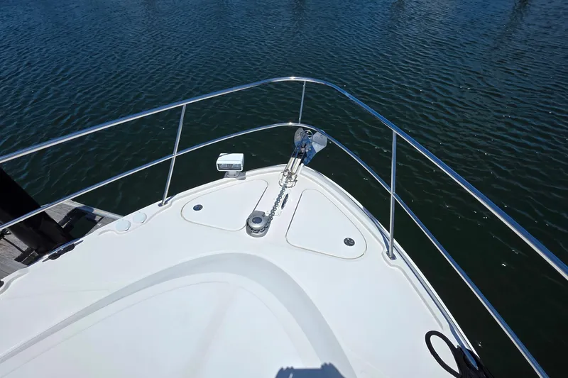 Slide: The Image of Bow view of 2018 Sea Ray Sundancer 510 yacht on calm water. - 29
