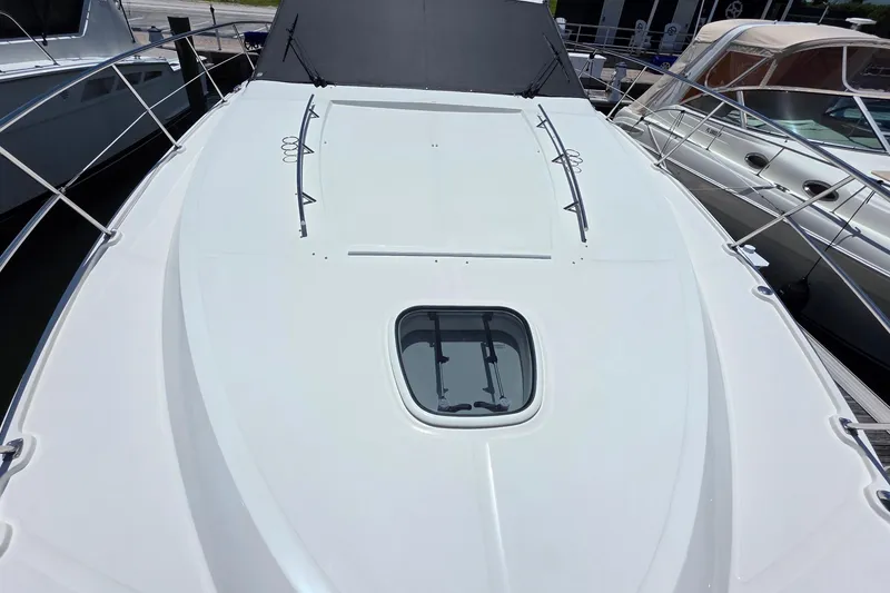 Slide: The Image of 2018 Sea Ray Sundancer 510 yacht deck with sleek design and hatch window. - 34