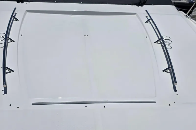 Slide: The Image of 2018 Sea Ray Sundancer 510 deck with sleek design and metal railings. - 36