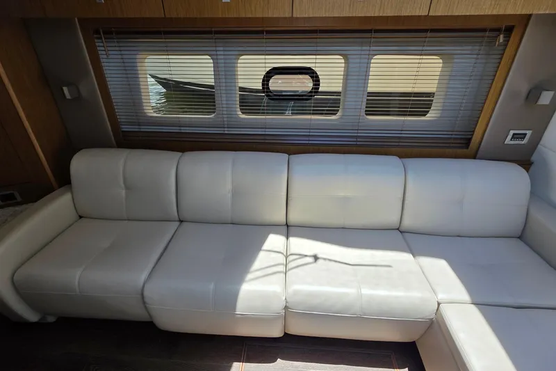Slide: The Image of Luxurious white leather seating inside 2018 Sea Ray Sundancer 510 yacht cabin. - 43