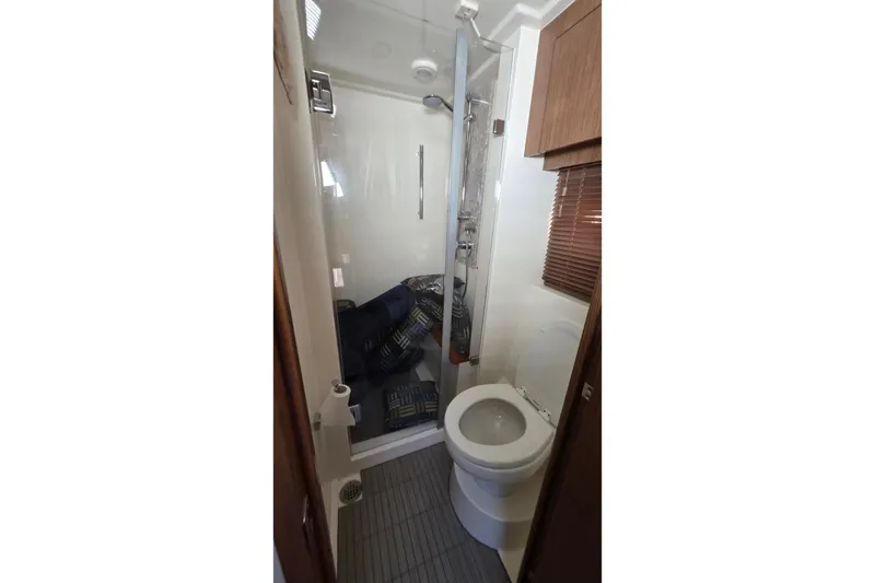 Slide: The Image of Bathroom interior of 2018 Sea Ray Sundancer 510 yacht, featuring shower and toilet. - 49