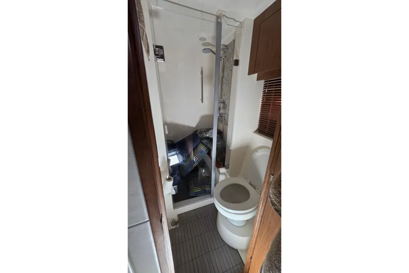Slide: The Image of Bathroom interior of 2018 Sea Ray Sundancer 510 yacht, featuring shower and toilet. - 51