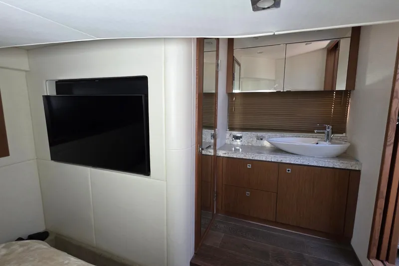 Slide: The Image of Luxurious interior of 2018 Sea Ray Sundancer 510 yacht with modern bathroom and TV. - 52