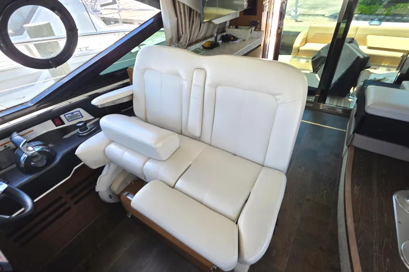 Slide: The Image of Luxurious interior of 2018 Sea Ray Sundancer 510 yacht with plush white seating. - 65