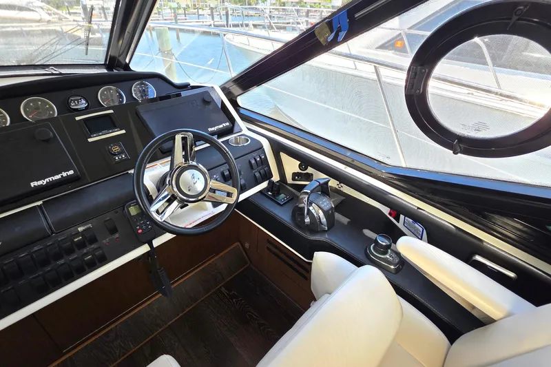 Slide: The Image of Helm of 2018 Sea Ray Sundancer 510 yacht with modern controls and navigation equipment. - 67