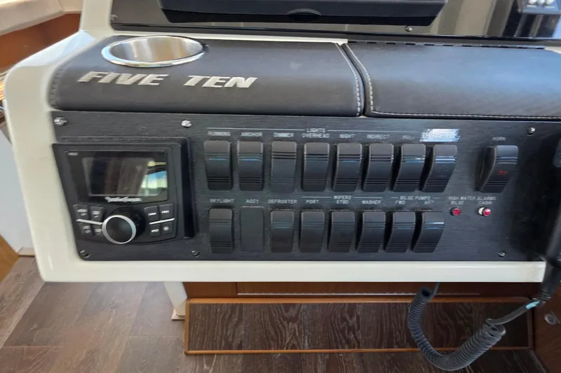 Slide: The Image of Control panel of a 2018 Sea Ray Sundancer 510 yacht with switches and audio system. - 68
