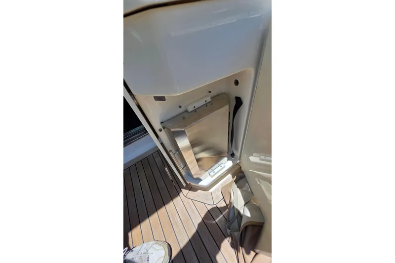 Slide: The Image of 2018 Sea Ray Sundancer 510 interior detail with wooden flooring and storage compartment. - 7