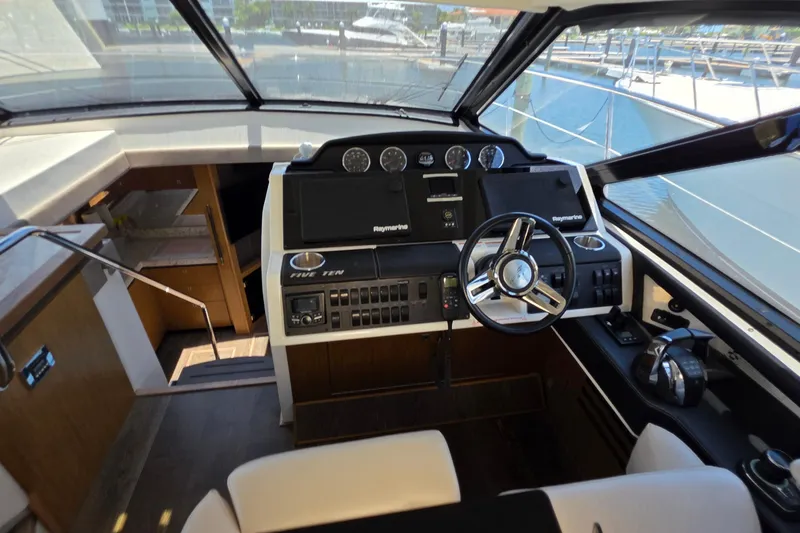 Slide: The Image of Helm of 2018 Sea Ray Sundancer 510 yacht with modern controls and steering wheel. - 71
