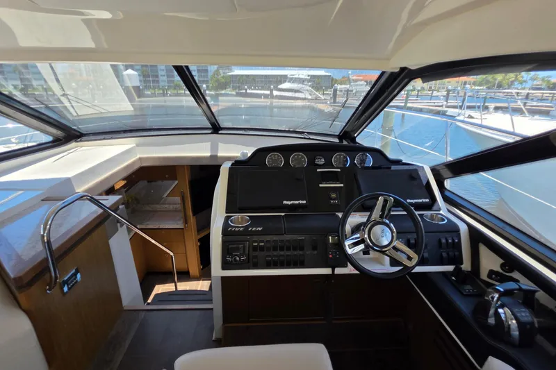 Slide: The Image of Interior helm of 2018 Sea Ray Sundancer 510 yacht with modern controls and panoramic view. - 72