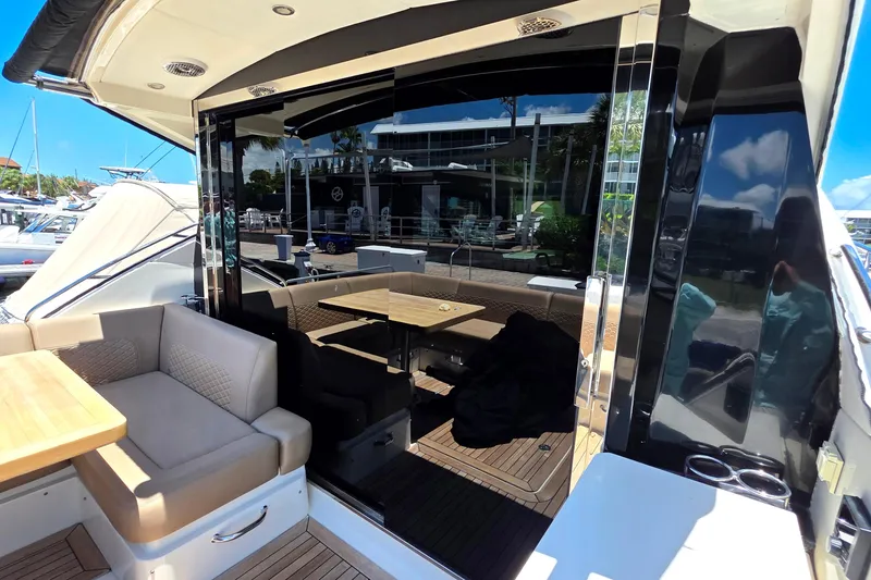 Slide: The Image of Luxurious 2018 Sea Ray Sundancer 510 yacht interior with seating and table. - 76
