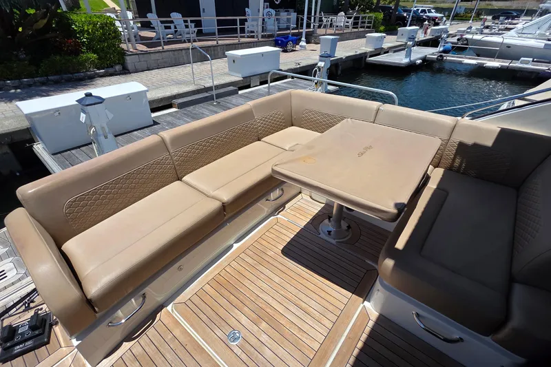Slide: The Image of Luxurious seating area on 2018 Sea Ray Sundancer 510 yacht with teak flooring. - 77