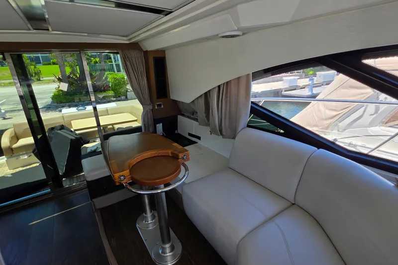 Slide: The Image of Luxurious interior of 2018 Sea Ray Sundancer 510 yacht with elegant seating and table. - 9