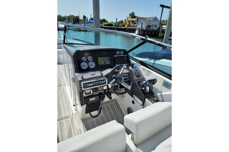 Slide: The Image of 2016 Formula 310 Bowrider helm with modern controls and navigation system. - 14