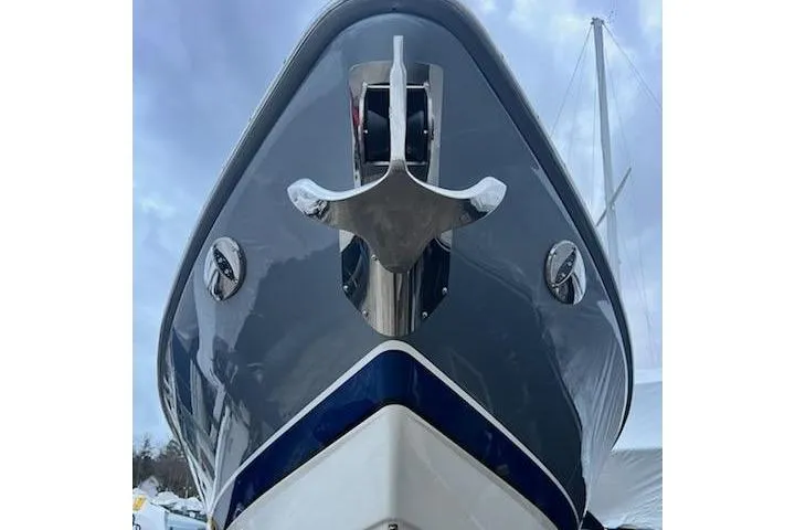 Slide: The Image of Front view of a 2016 Formula 310 Bowrider boat with anchor and sleek design. - 19