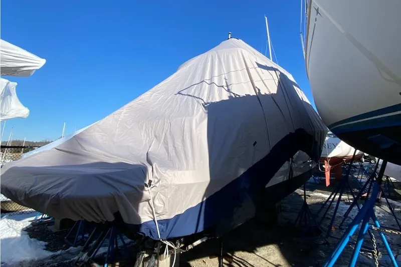 Slide: The Image of Covered 2016 Formula 310 Bowrider boat in storage, under a protective tarp. - 22