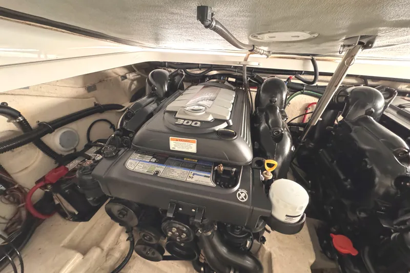 Slide: The Image of Engine compartment of a 2016 Formula 310 Bowrider, showcasing a powerful 300 HP engine. - 26