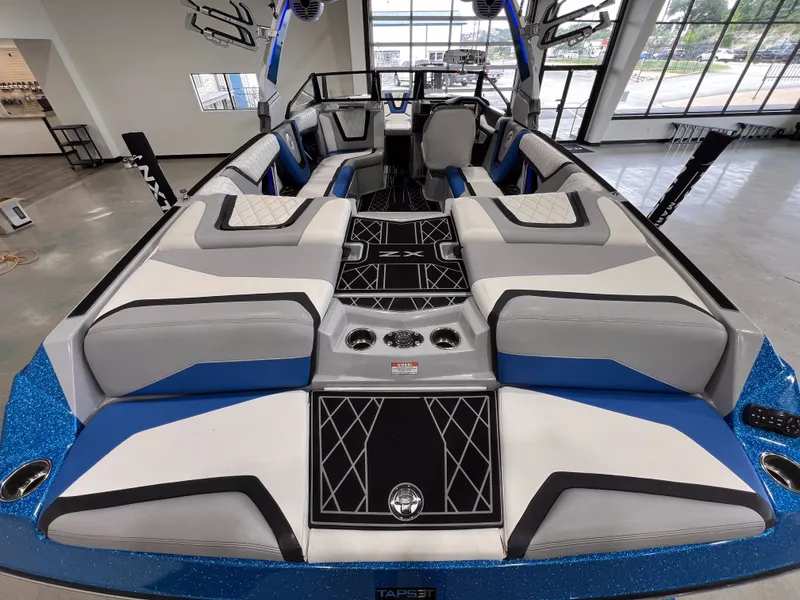 Slide: The Image of Interior of a 2021 Tigé 25ZX boat with luxurious seating. - 10