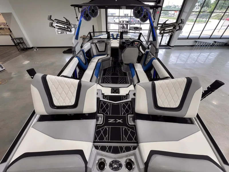 Slide: The Image of Interior of a 2021 Tigé 25ZX boat with luxurious seating. - 12