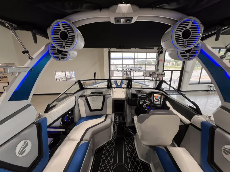 Slide: The Image of Interior of 2021 Tigé 25ZX with modern seating and speakers. - 14